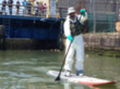 photo: wearing a hazard suit in the gowanus canal is a very good idea